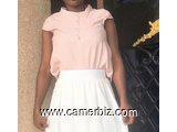 Blouse classe sans manche couleur pêche T38 4.990 F CFA (CB0029) - 16905